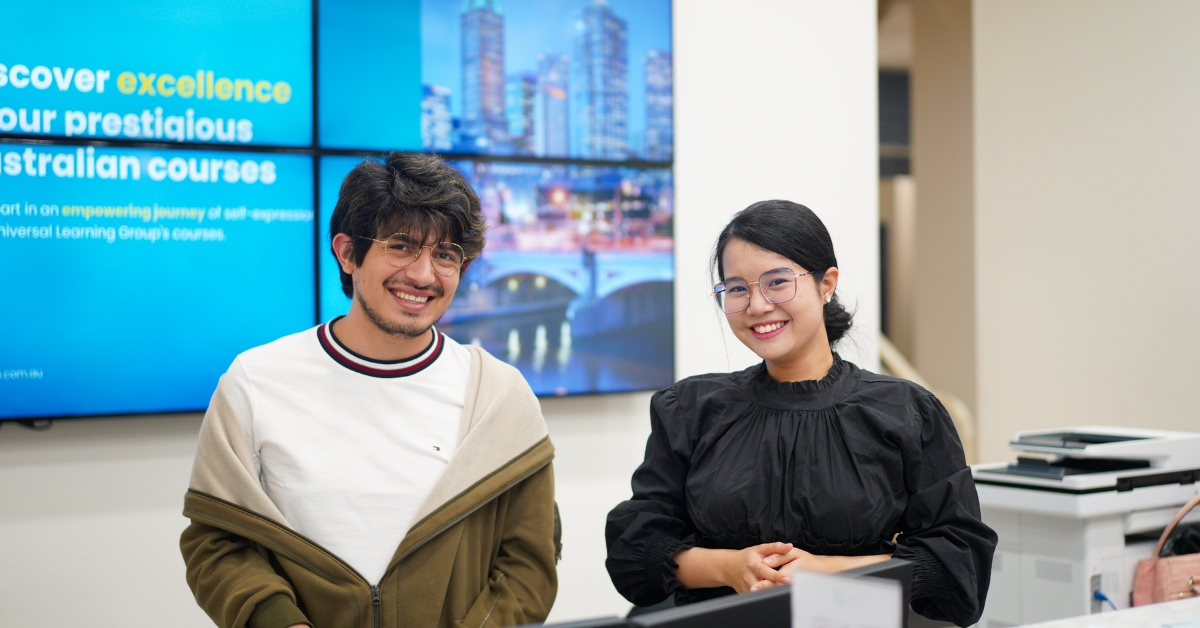 Students smiling as they pose for a photo